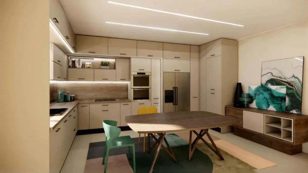 Ευρύχωρη μοντέρνα κουζίνα σε μπεζ αποχρώσεις με εντοιχισμένες συσκευές, μεγάλη ξύλινη τραπεζαρία με πράσινη και κίτρινη καρέκλα, πολύχρωμο χαλί και διακοσμητικό μπουφέ με πίνακα.