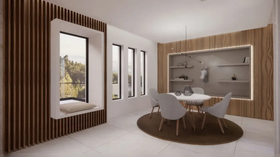 Μοντέρνα τραπεζαρία με ξύλινη επένδυση τοίχου και ενσωματωμένο κάθισμα παραθύρου, στρογγυλό τραπέζι με λευκές καρέκλες και εσοχή με ράφια και κρυφό φωτισμό.