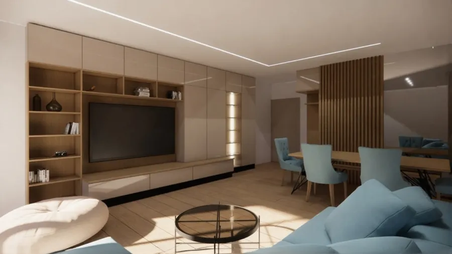 Ευρύχωρο σαλόνι με μεγάλη σύνθεση τηλεόρασης σε μπεζ και ξύλο, γαλάζιο γωνιακό καναπέ, τραπεζαρία με ασορτί καρέκλες και διαχωριστικό χώρου με κάθετα ξύλινα πηχάκια.